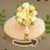 華やかな花飾りの植木鉢猫と秘密の森